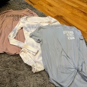 Girl’s Abercrombie tops. Three. Two long sleeve. One short sleeve. Size 13/14.